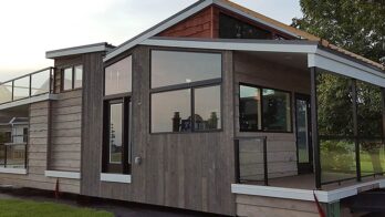 The Denali tiny home sitting in neighborhood