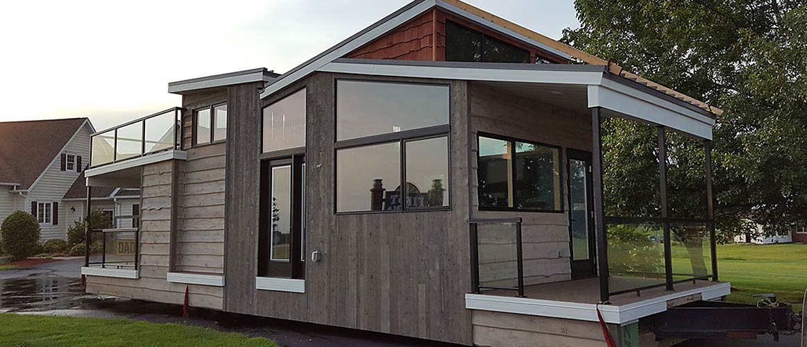 The Denali tiny home sitting in neighborhood